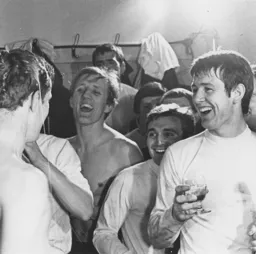 John Moore has champagne poured over his head