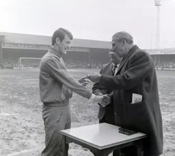 Bruce Rioch gets his medal