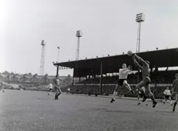 Oldham keeper David Best catches the ball as Laurie Sheffield jumps in
