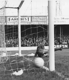 The Watford keeper is beaten from the spot