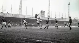 Jim Cumbes had a busy afternoon. Here he clears the ball away from Brian Lewis