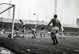 Rovers keeper Jim Cumbes diverts the ball away from Alan Slough