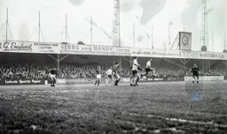 The ball falls between Brian Lewis and Laurie Sheffield