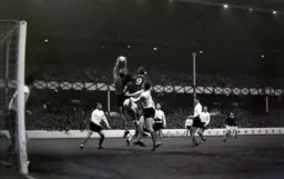 Tony Read makes a good safe catch under pressure from Joe Royle