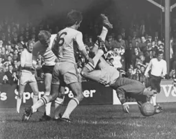 Brian Lewis watches as the Torquay goalkeeper falls on the ball