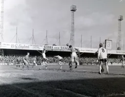 Wilson Hepplewhite heads the ball clear watched by Terry Branston and Brian Lewis