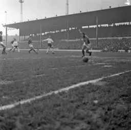 Everyone watches as the ball flies wide