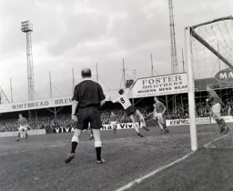 Mike Keen flies in but misses the ball