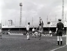 Walsall keeper Bob Wesson grabs the ball as Keith Allen and Mike Keen watch
