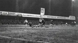 Keith Allen bursts through the defence but his shot is blocked