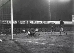 Laurie Sheffield falls over the top of John Phillips