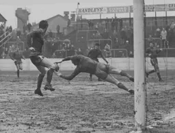 Millers goalkeeper Jim Furnell grasps the ball without a Luton player in sight