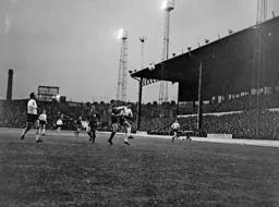 The ball is knocked away from Brian Lewis