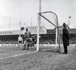 Keith Allen and PC Plod watch as Terry Branston`s header finds the net