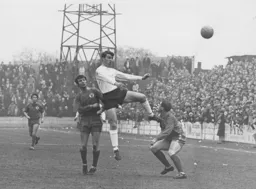 Billy McDerment heads the ball on