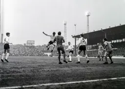 Mike Keen heads the ball down with Brian Lewis and Terry Branston in support