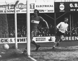 Brian Lewis wheels away after scoring the Town's second goal