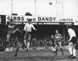 Mike Keen wins the ball with Ian Buxton waiting for it to drop