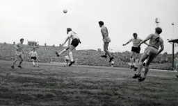 Keith Allen heads the ball towards Max Dougan