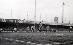 Brian Lewis and Duncan Welbourne challenge for a high ball