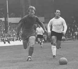 Laurie Sheffield puts pressure on the Barrow defence