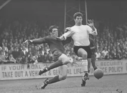 Malcolm Macdonald receives close attention from a Barrow defender