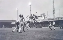 Malcolm Macdonald tussles with Chris Nicholl his new teammate the following day