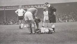 Keith Allen looks concerned for Torquay player