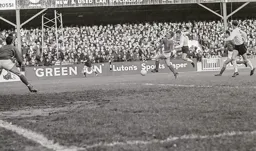 Malcolm Macdonald fires towards goal