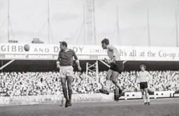 Malcolm Macdonald heads for goal