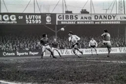 Malcolm Macdonald heads for goal