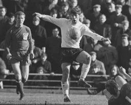 Malcolm Macdonald lays the ball off