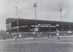 Malcolm Macdonald gets to the ball first