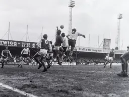 Malcolm Macdonald tries to get his head to the ball first