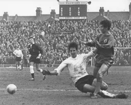 Chris Nicholl slides in