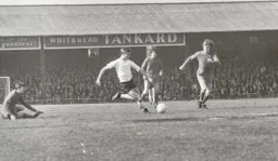 Viv Busby tries a long range shot