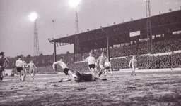 Viv Busby goes in on the Walsall keeper