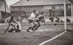 Malcolm Macdonald watches the ball cross the line