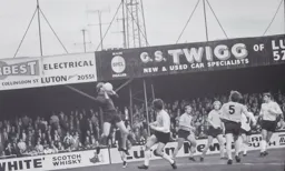 The keeper collects in front of Don Givens