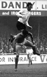 Mike Keen defends deep at a soggy Kenilworth Road
