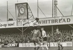 Mike Keen gets in a towering header