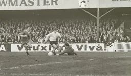 Malcolm Macdonald rounds the keeper