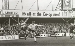 Malcolm Macdonald heads for goal