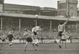 Don Givens wins the header