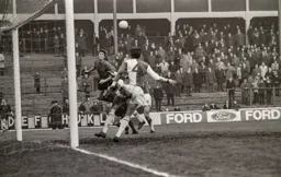 Mike Keen heads across goal