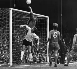 Viv Busby puts the Blues goalkeeper under pressure
