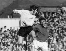 Malcolm Macdonald wins his header