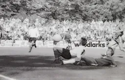 Viv Busby tackled from behind