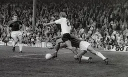 Viv Busby attempts to outwit the Burnley keeper