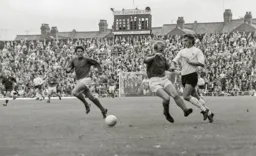 Viv Busby fouled with a hgh tackle